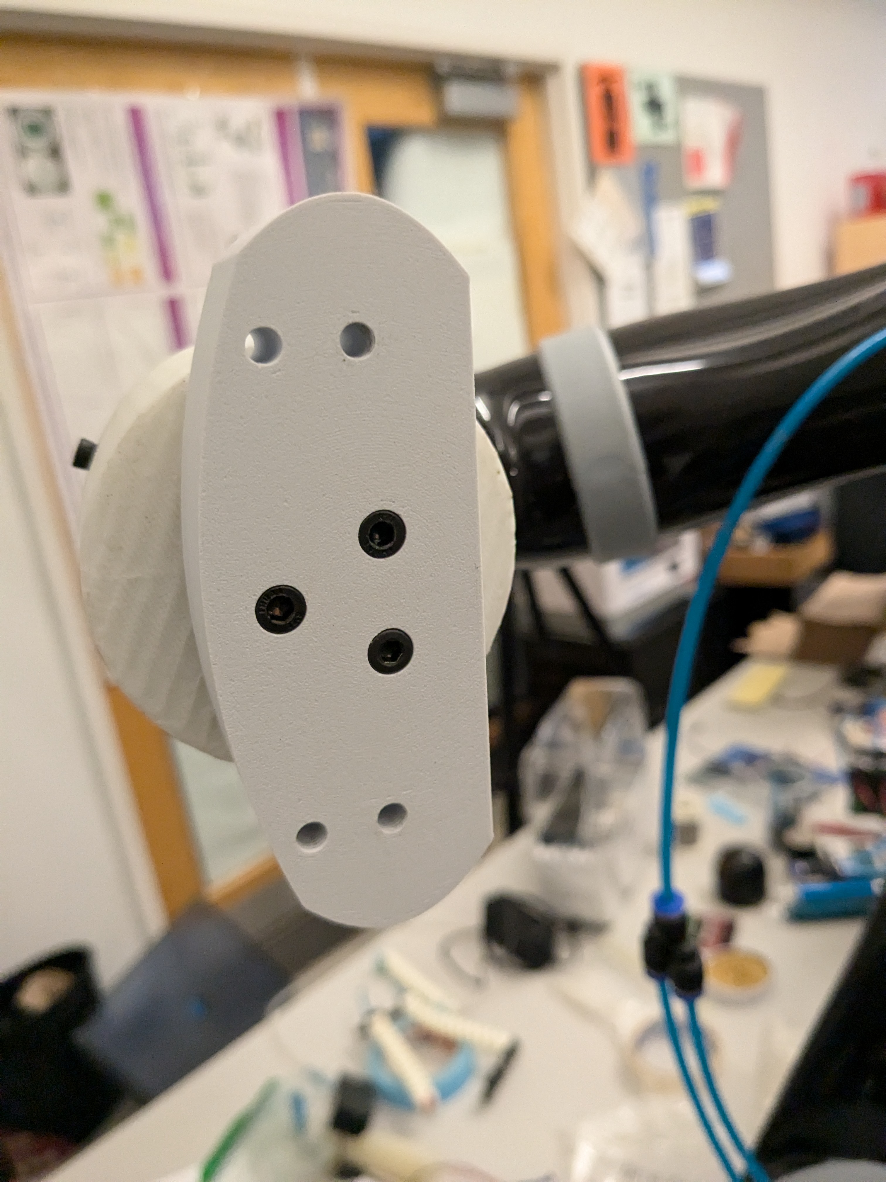 3D-printed adapter mounting the prosthetic hand to a Kinova robotic arm