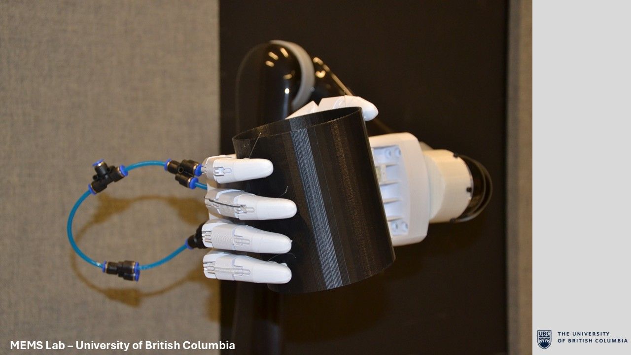 Tendon-driven prosthetic hand grasping an object on a Kinova robotic arm