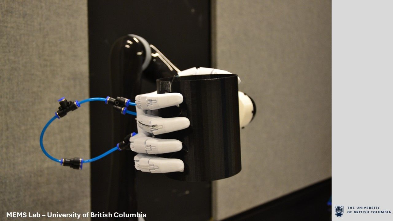 Final prosthetic hand holding a large black object