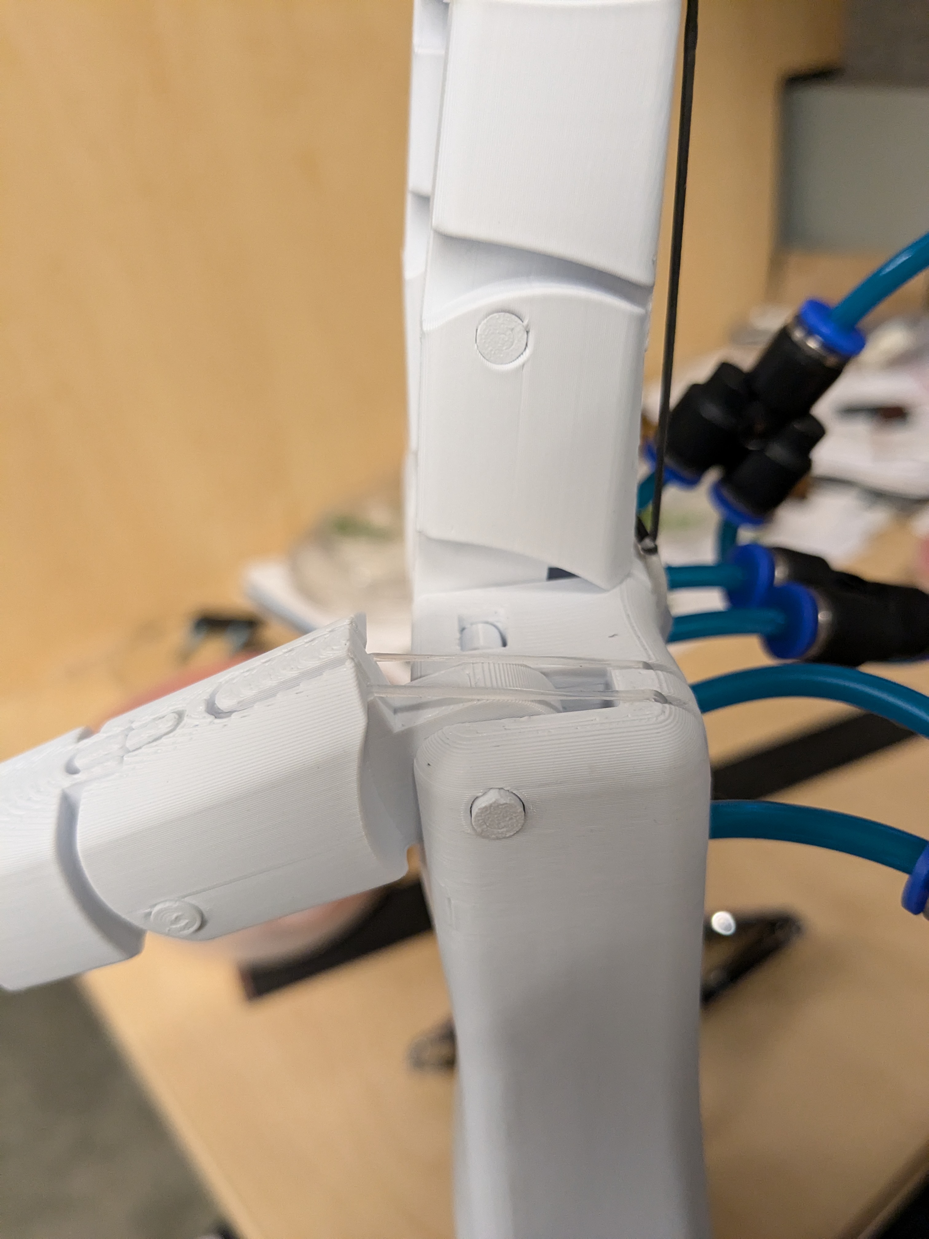 Custom clear silicone return bands installed across a finger joint