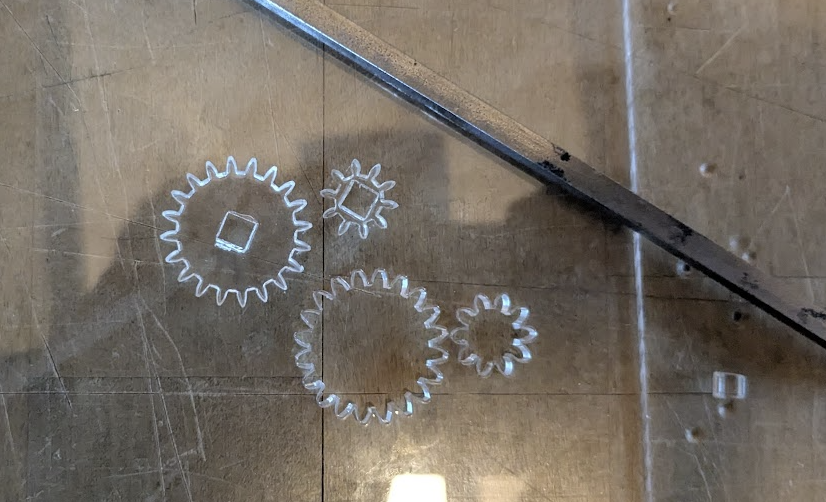 Lasercut acrylic gears and bearing adapters for the hauler's gearbox